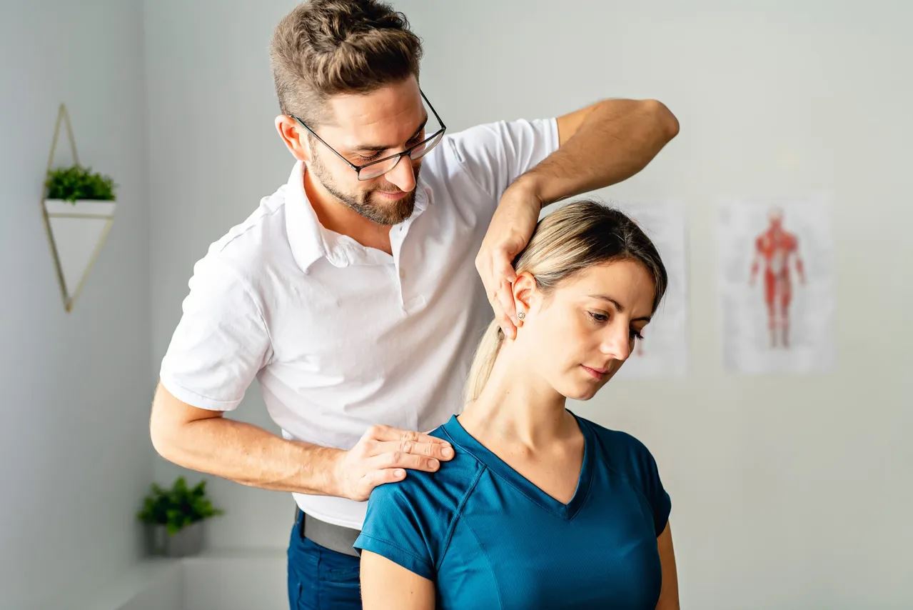 benefits chiropractic care professional with patient making neck adjustment